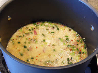 Boil rice for vegetable risotto