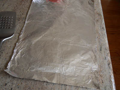 Spread a large piece of aluminum foil