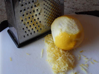 Grate the lemon zest for blueberry cake