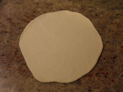 Roll the pita bread dough