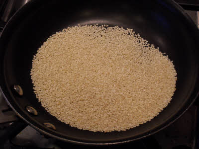 Roast sesame seeds for tahini sauce