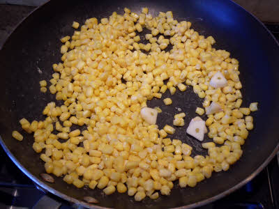 Roast corn and garlic for enchilada sauce