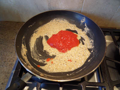 Add tomato paste for tomato enchilada sauce