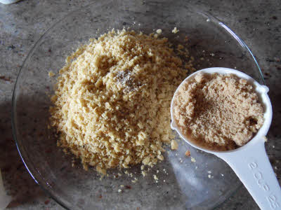 Add ghee and sugar to roti crumbs for churma