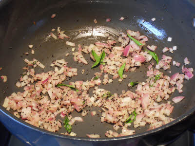 Cook onions for tomato rice