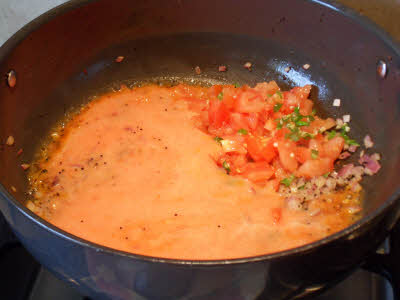 Cook tomatoes for tomato rice