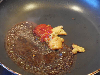 Add soy sauce, chilli sauce, vinegar and sugar