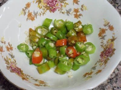 Wash and chop the green chillies