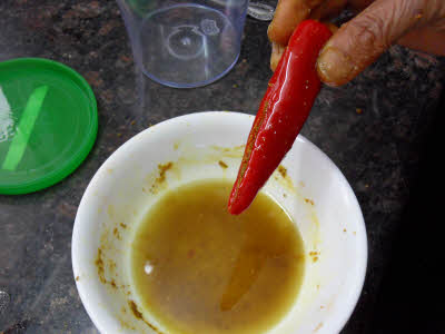 Dip each chili in the remaining oil