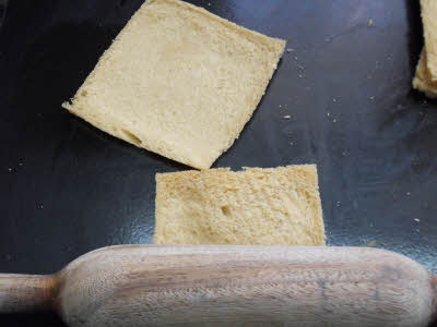 Flatten each bread slice