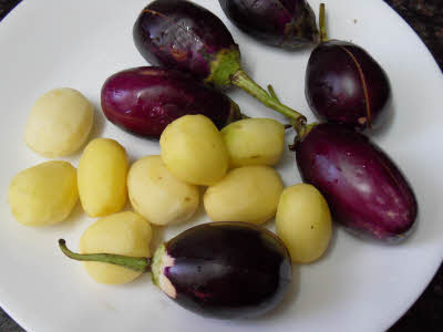 Slit eggplants and potatoes