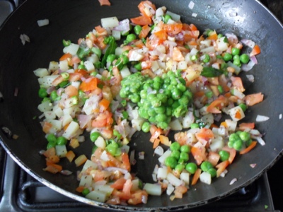 Added peas and tomatoes