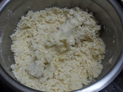 Oiling the Shakkar Pare flour