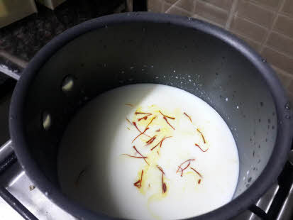 Boil milk and sugar for besan halwa