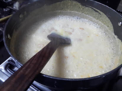 Add boiling milk to besan