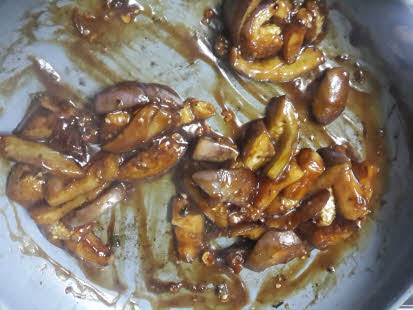 Mix sauteed eggplant in garlic sauce