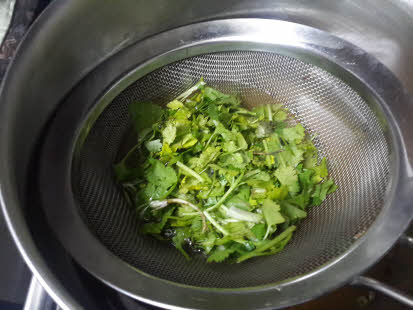 Boil coriander leaves for Lemon Coriander Soup