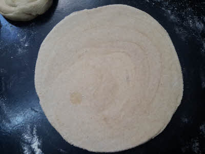 roll the dough for Lachcha Roti