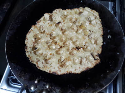 Add sugar and seeds on roti