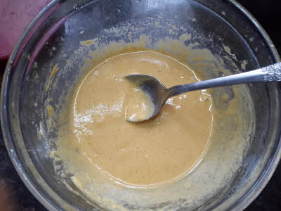 Preparing batter for kaddu ke phool ki pakori