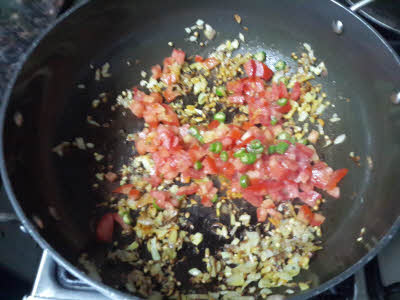 Cook onion and tomato