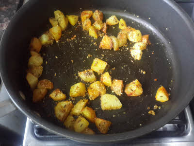 Add cumin powder, turmeric powder, chillies powder, coriander powder