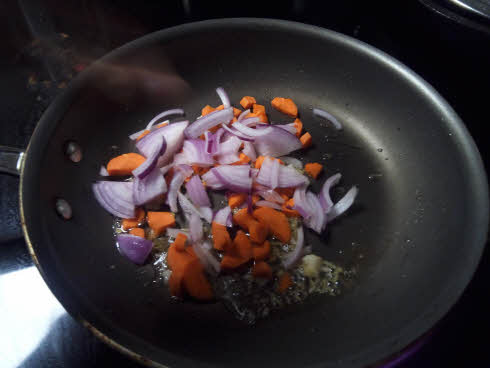 Fry carrots and onions