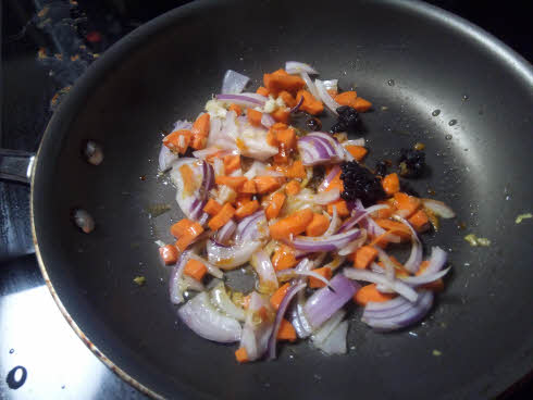 Fry carrots and onions