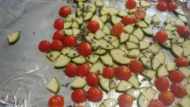 Toss tomatoes, zucchini and half of thyme