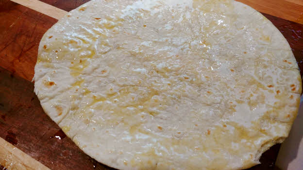 Brush tortillas with olive oil