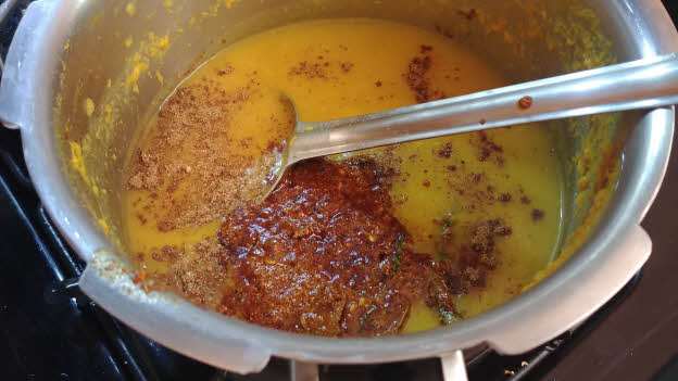 Mix the tempering into the dal