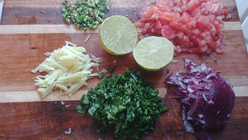 Chop onions, tomatoes, cilantro and green chillies