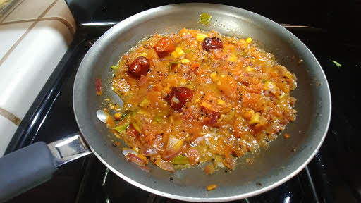 Cook tomatoes, kari leaves and salt