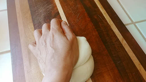 Use the stretch and roll method until the dough is silky smooth