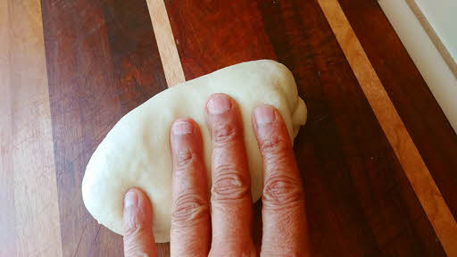 Use the stretch and roll method until the dough is silky smooth