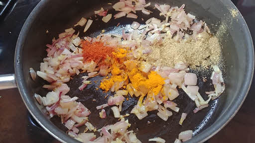 Add turmeric powder, chili powder, coriander powder