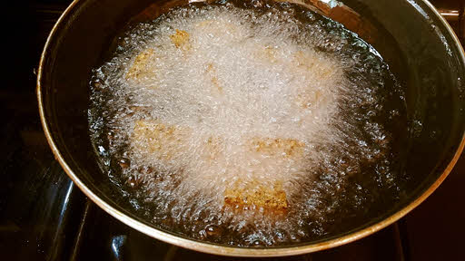 Fry urad dal pieces till golden brown.