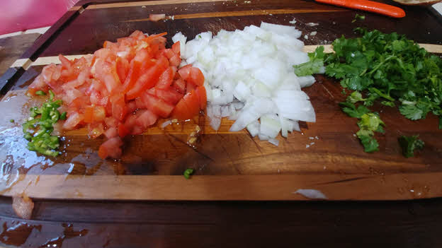 chop tomato, onion, green chillies and fresh cilantro finely