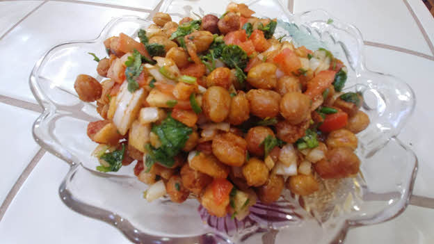 Toss chickpeas with tomato, onion, chillies