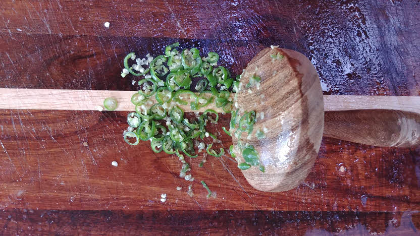 Mash chopped green chillies