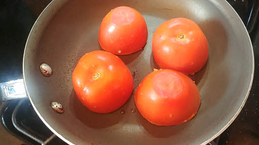 Cook stuffed tomatoes