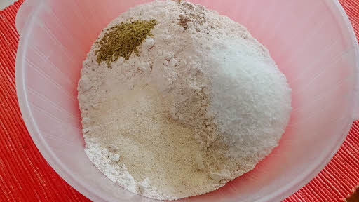 Mix flour, semolina, crushed fennel, ground cardamom and coconut powder