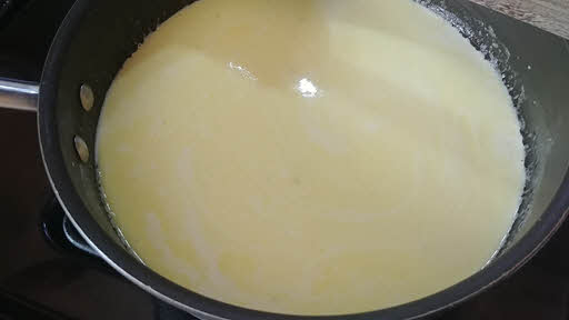 Add cream and milk and boil