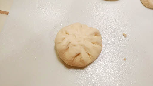 Make a stuffed kulcha dough ball