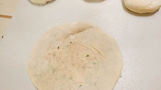 Roll the stuffed kulcha dough