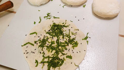 Roll the stuffed kulcha dough