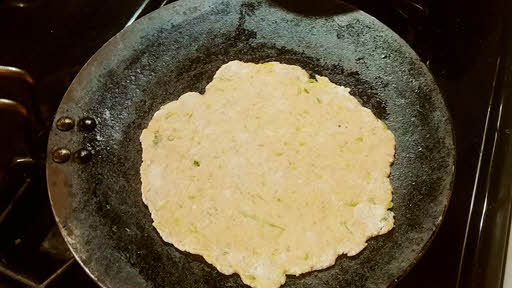 Place the thepla on a hot griddle