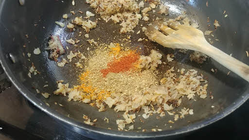 Add turmeric powder, chilli powder, coriander powder