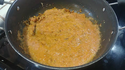 Add pureed tomatoes and cook