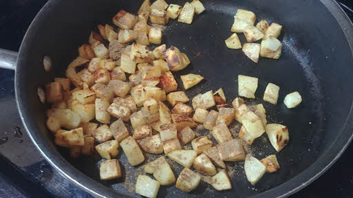 Add spices to potatoes
